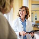 photo of doctor holding tablet