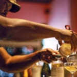 Chris Marshall mixes drinks at Sans Bar in Austin, Texas.